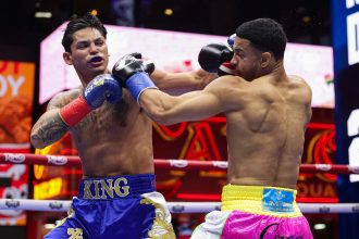 Ryan Garcia and Rolly Romero exchange punches during a fight for the WBA Welterweight title in Times Square on May 2 in New York City.