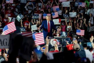 President Donald Trump arrives for a 100th day rally in Warren, Michigan, on Tuesday, April 29.
