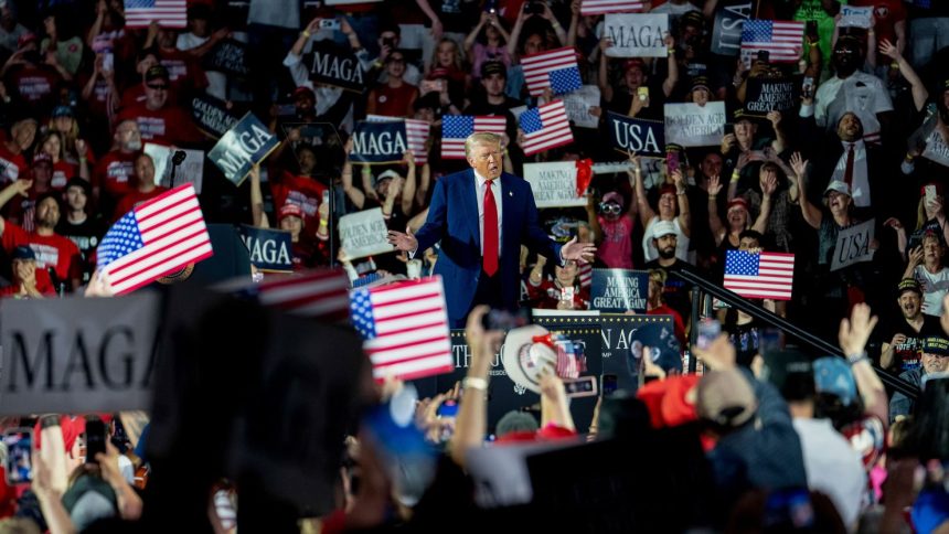 President Donald Trump arrives for a 100th day rally in Warren, Michigan, on Tuesday, April 29.