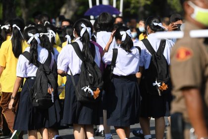 Students wearing the standard Thai school uniform and white ribbons in their hair as a sign of protest in Bangkok, Thailand, on August 19, 2020.