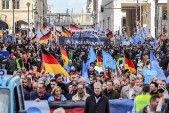 People march at a demonstration organized by the Alternative for Germany political party on October 8, 2022 in Berlin, Germany.