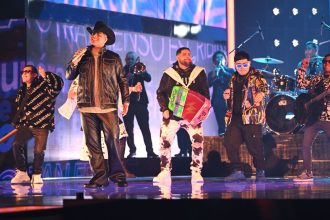 Grupo Firme performs onstage during the 35th Premio Lo Nuestro at Miami-Dade Arena on February 23, 2023, in Miami, Florida.