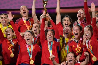 Ivana Andres of Spain lifts the World Cup trophy following victory after the FIFA Women's World Cup Australia & New Zealand 2023 Final.