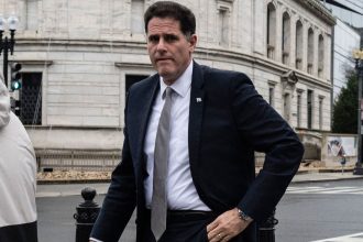 Israel's Minister for Strategic Affairs, Ron Dermer, looks on as he walks into the Executive Office Building next to the White House in Washington, DC on December 26, 2023.