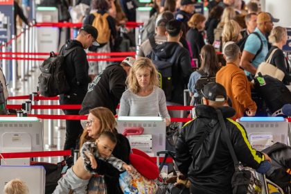 Passengers prepare for flights at Los Angeles International Airport in May 2024. The summer of 2025 is expected to be especially busy at airports.