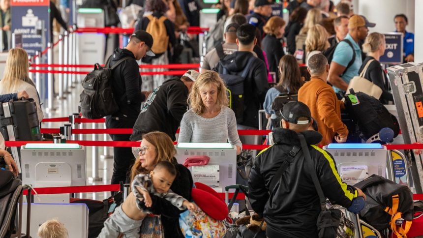Passengers prepare for flights at Los Angeles International Airport in May 2024. The summer of 2025 is expected to be especially busy at airports.