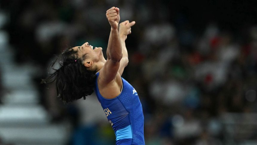 India's Vinesh Phogat reacts to beating Japan's Yui Susaki in their women's freestyle 50kg wrestling early rounds match at the Champ-de-Mars Arena on August 6.