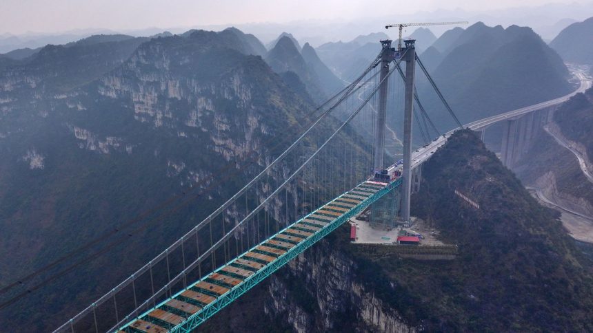 Aerial view of a construction site at the Huajiang Grand Canyon Bridge taken on January 17, 2025.
