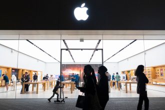 People walk by an Apple store at the Westfield UTC shopping center on January 31, 2025 in San Diego, California.
