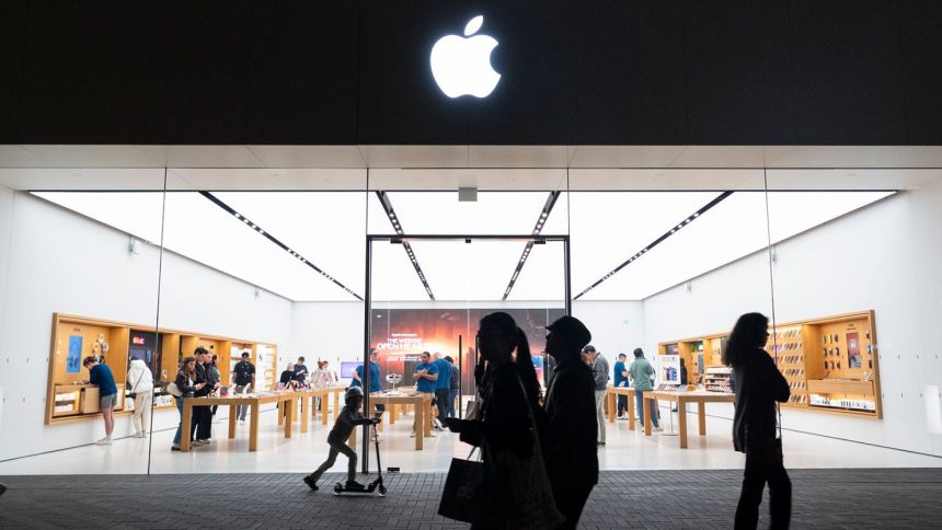 People walk by an Apple store at the Westfield UTC shopping center on January 31, 2025 in San Diego, California.