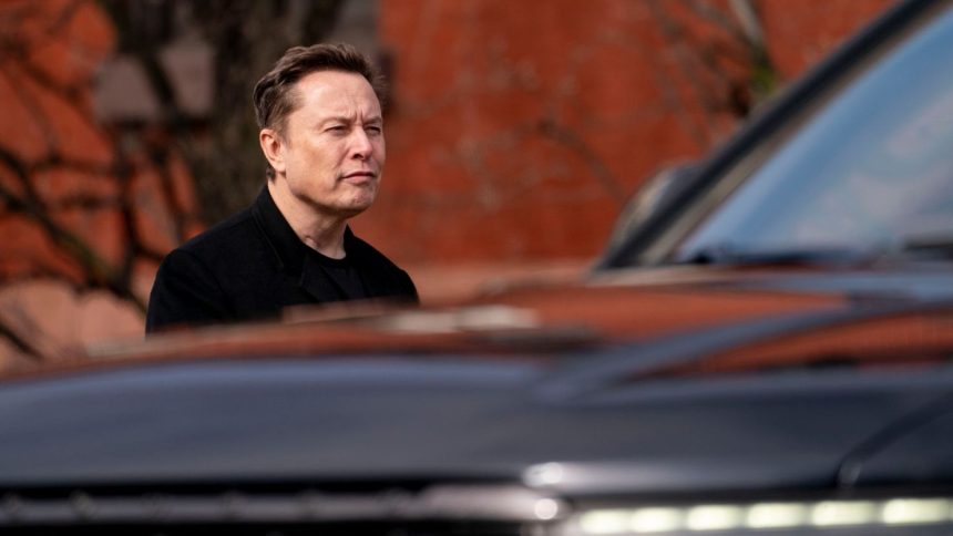 Elon Musk, chief executive officer of Tesla, walks to the Eisenhower Executive Office Building near the White House in Washington, DC.