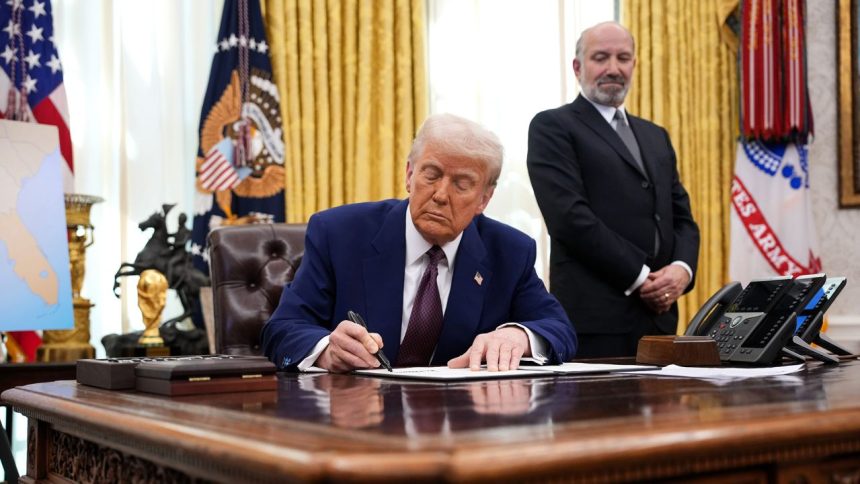 U.S. President Donald Trump, joined by Secretary of Commerce Howard Lutnick, signs an executive order on reciprocal tariffs in the Oval Office at the White House on February 13, 2025 in Washington, DC. Trump announced his plan to increase U.S. tariffs to match the rates other nations charge to import American goods.