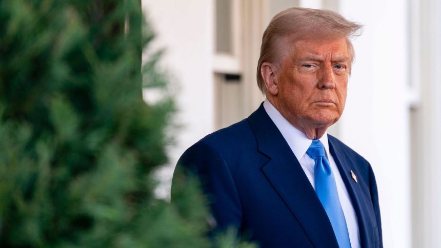 President Donald Trump awaits French President Emmanuel Macron outside the West Wing of the White House in February. The pair met to discuss the Russia-Ukraine war.