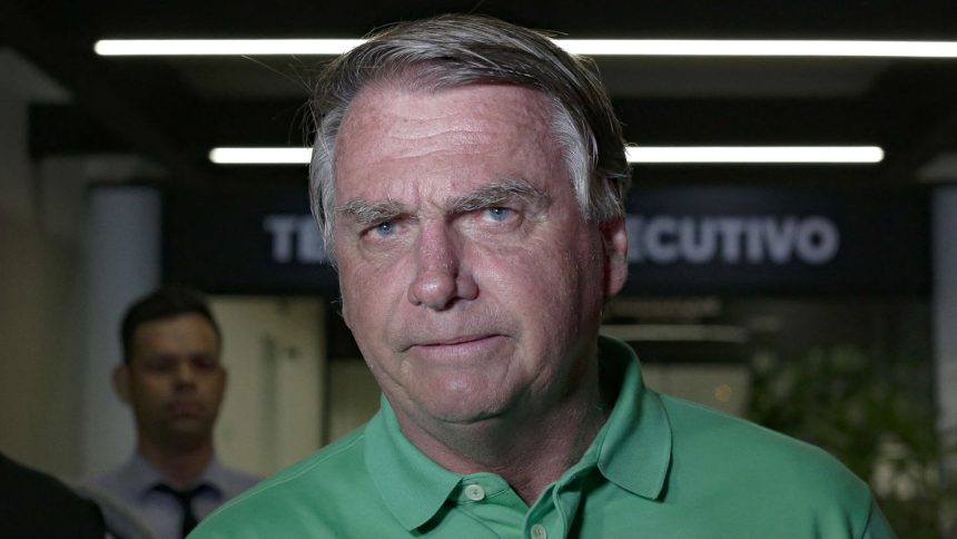 Jair Bolsonaro, pictured on arrival at Brasilia airport on March 6, 2025, was hospitalized on Friday after experiencing strong abdominal pains.