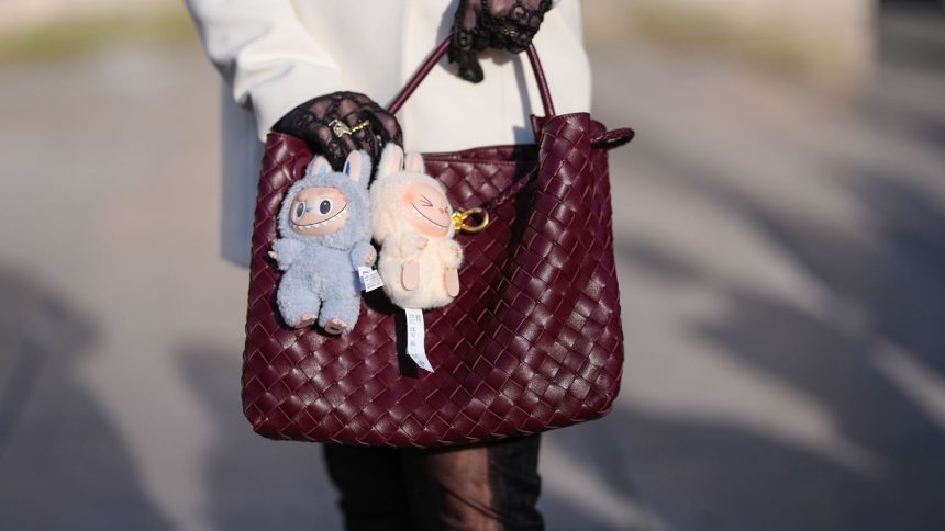 A Bottega Veneta bag with Labubu bag charms during Paris Fashion Week on March 8, 2025. The impish yet cute plushies are a global sensation among Gen Z and even those older.