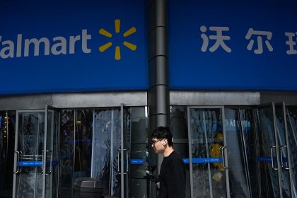 A man walks past a Walmart supermarket in Beijing on April 10, 2025.