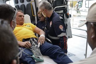 Former Brazilian president Jair Bolsonaro arrives by ambulance at the Rio Grande Hospital in Brazil on Friday.