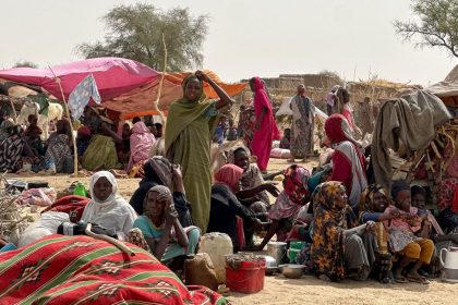 People who fled the Zamzam camp for the internally displaced after it fell under RSF control, rest in a makeshift encampment in an open field near the town of Tawila in war-torn Sudan's western Darfur region on April 13, 2025.