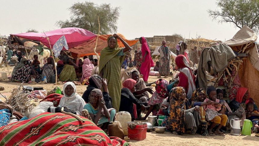 People who fled the Zamzam camp for the internally displaced after it fell under RSF control, rest in a makeshift encampment in an open field near the town of Tawila in war-torn Sudan's western Darfur region on April 13, 2025.