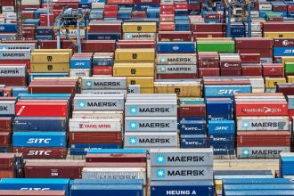 An aerial view shows cargo containers stacked at a port in Shanghai on April 20.