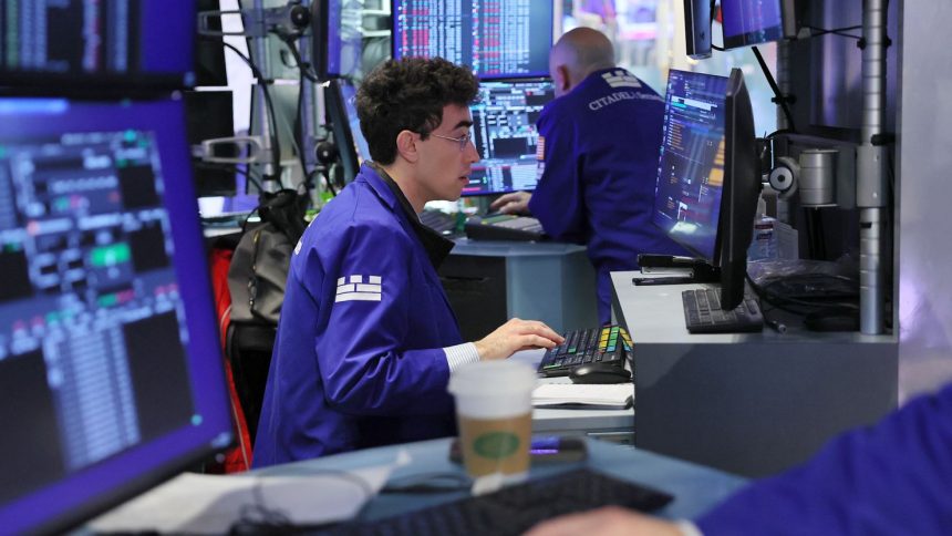 Traders work on the floor of the New York Stock Exchange.
