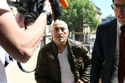 Defendant Yunice Abbas and his lawyer arrive for the start of the trial in Paris on Monday, April 28, 2025.