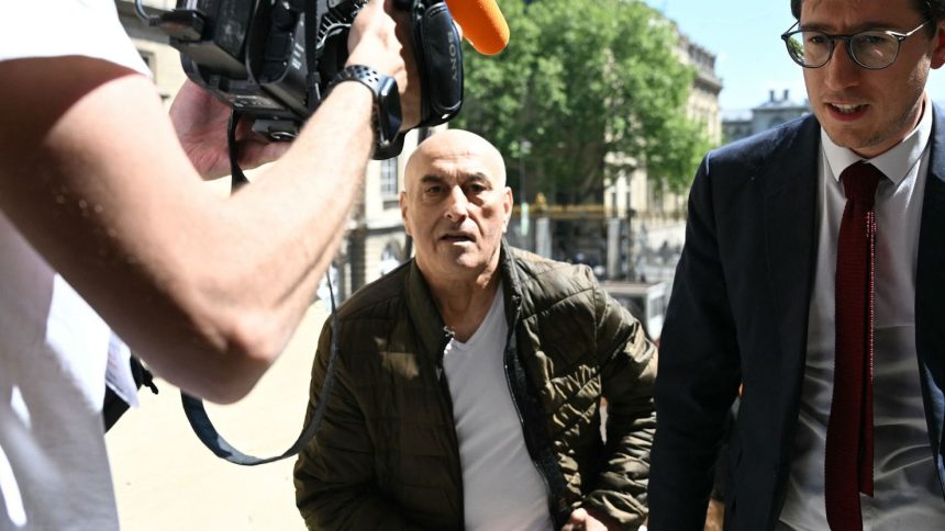 Defendant Yunice Abbas and his lawyer arrive for the start of the trial in Paris on Monday, April 28, 2025.