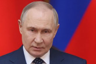 Russian President Vladimir Putin delivers a speech on April 28 in St. Petersburg, Russia.