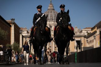 Italy's Carabinieri patrol near St Peter's square in The Vatican on May 1, 2025.