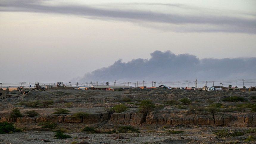 Smoke rises from the airport of Port Sudan, the seat of the Sudanese army-aligned government on the Red Sea coast, following reported attacks early on Sunday.