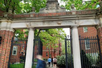People enter Harvard Yard in May. The Trump administration is moving to bar foreign enrollment.