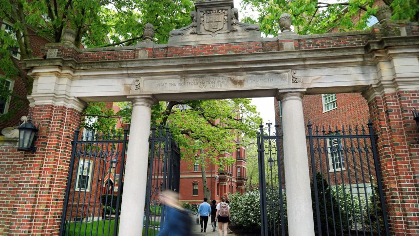 People enter Harvard Yard in May. The Trump administration is moving to bar foreign enrollment.