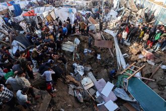 People search for survivors in the aftermath of an Israeli strike on a school compound in central Gaza on May 6, 2025.