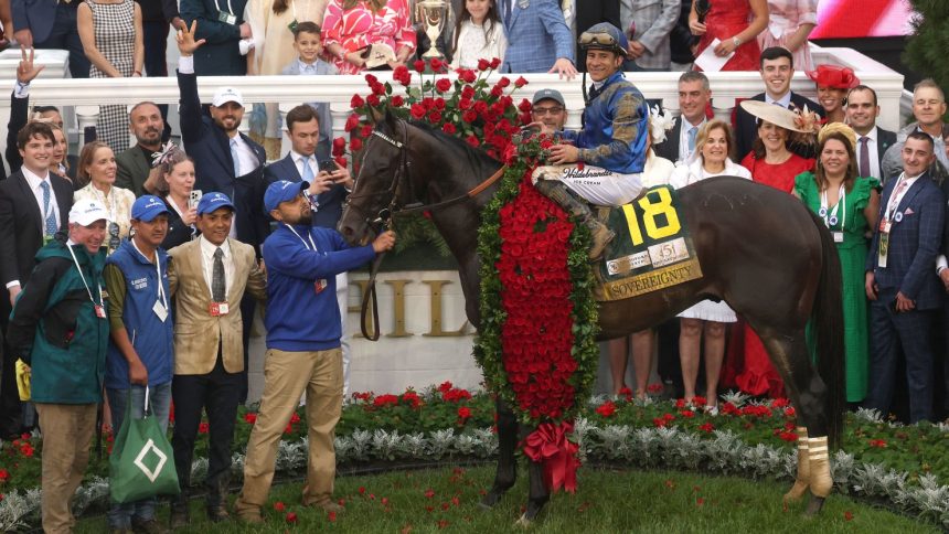 Sovereignty and jockey Junior Alvarado pose for pictures after winning the 151st running of the Kentucky Derby.