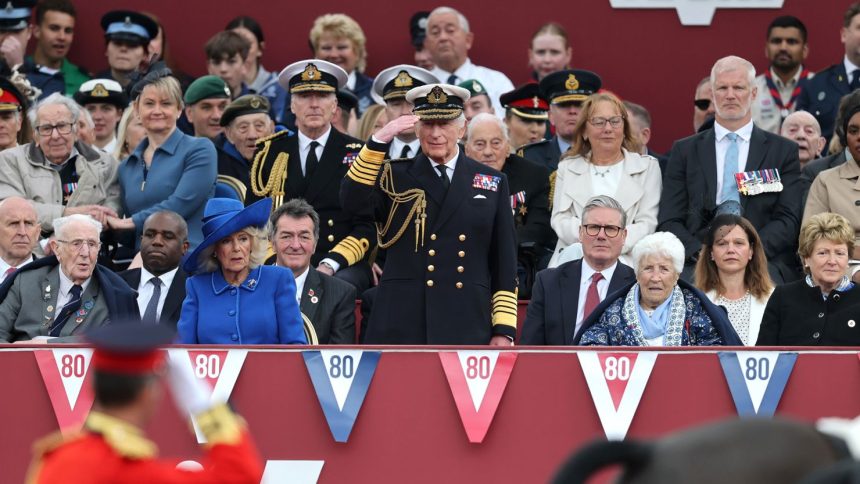 King Charles salutes a military procession to mark the 80th anniversary of VE Day in London.