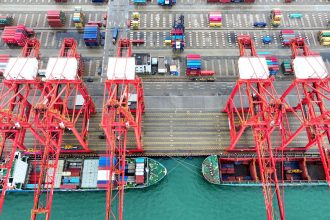 A cargo ship moors at the container terminal berth of Lianyungang Port for loading and unloading containers in Lianyungang City, Jiangsu Province, China, on May 9, 2025.
