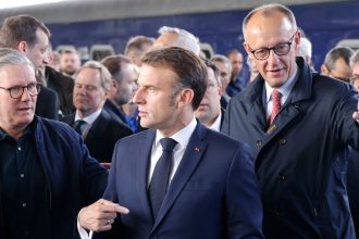 Britain's Prime Minister Keir Starmer, France's President Emmanuel Macron and Germany's Chancellor Friedrich Merz arrive at Kyiv railway station on May 10, 2025.
