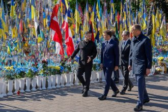 From left: Ukraine's President Volodymyr Zelensky, France's President Emmanuel Macron, Britain's Prime Minister Keir Starmer and Germany's Chancellor Friedrich Merz pay their respects to the victims of war at the Memorial for the Fallen at the Independence Square (Maidan) in Kyiv on May 10, 2025, ahead of a gathering of European leaders in the Ukranian capital.