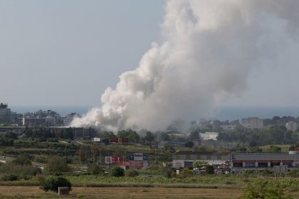 Smoke billows from a building storing pool cleaning products in the coastal city of Vilanova i la Geltru, Spain, on Saturday.