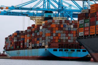 Container ships sit docked at the Port of Los Angeles in San Pedro, California, on Tuesday.