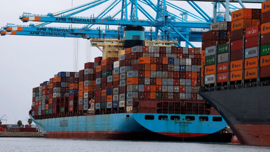 Container ships sit docked at the Port of Los Angeles in San Pedro, California, on Tuesday.