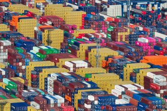 Containers are stacked at a port in Nanjing, in eastern China's Jiangsu province on May 12.