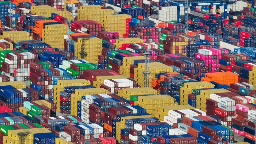 Containers are stacked at a port in Nanjing, in eastern China's Jiangsu province on May 12.