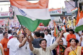 People celebrate in Ghaziabad, India after a ceasefire was announced between India and Pakistan, on Saturday.