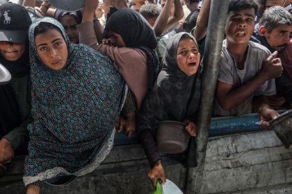 Charitable organizations distribute hot meals to Palestinians in the Al-Mawasi area of Khan Yunis, Gaza on May 12.