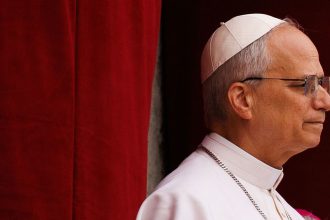 Pope Leo delivers delivers his first Sunday blessing from the balcony of St. Peter's Basilica at the Vatican on May 11.
