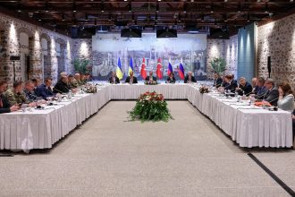 Turkish Foreign Minister Hakan Fidan, center, chairs a trilateral meeting between Turkey, Russia and Ukraine in Istanbul on May 16.