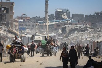 Palestinians in the Gaza Strip flee with their possessions following intensified Israeli military attacks on May 16, 2025.
