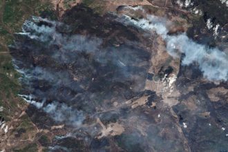 A satellite view of the rapidly spreading wildfires in the Siberian republic of Buryatia, located in the Russian Far East near Lake Baikal, on Tuesday. Authorities have declared a state of emergency as massive blazes engulf thousands of hectares.