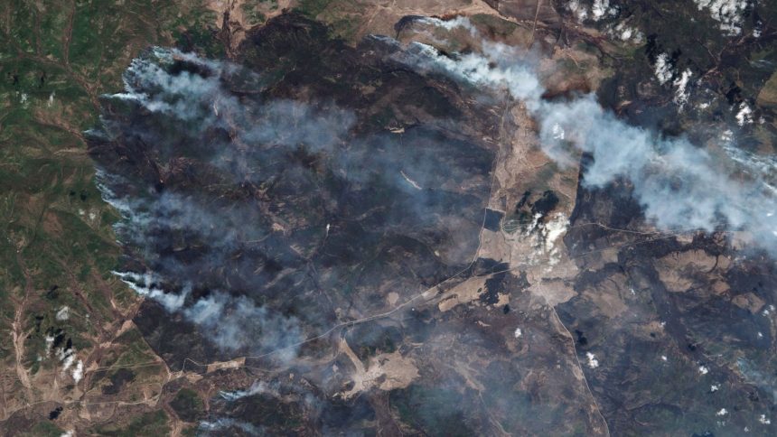 A satellite view of the rapidly spreading wildfires in the Siberian republic of Buryatia, located in the Russian Far East near Lake Baikal, on Tuesday. Authorities have declared a state of emergency as massive blazes engulf thousands of hectares.